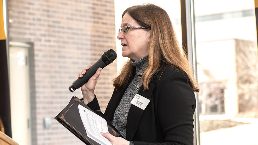 Marcia Dixson talking at a new faculty event.