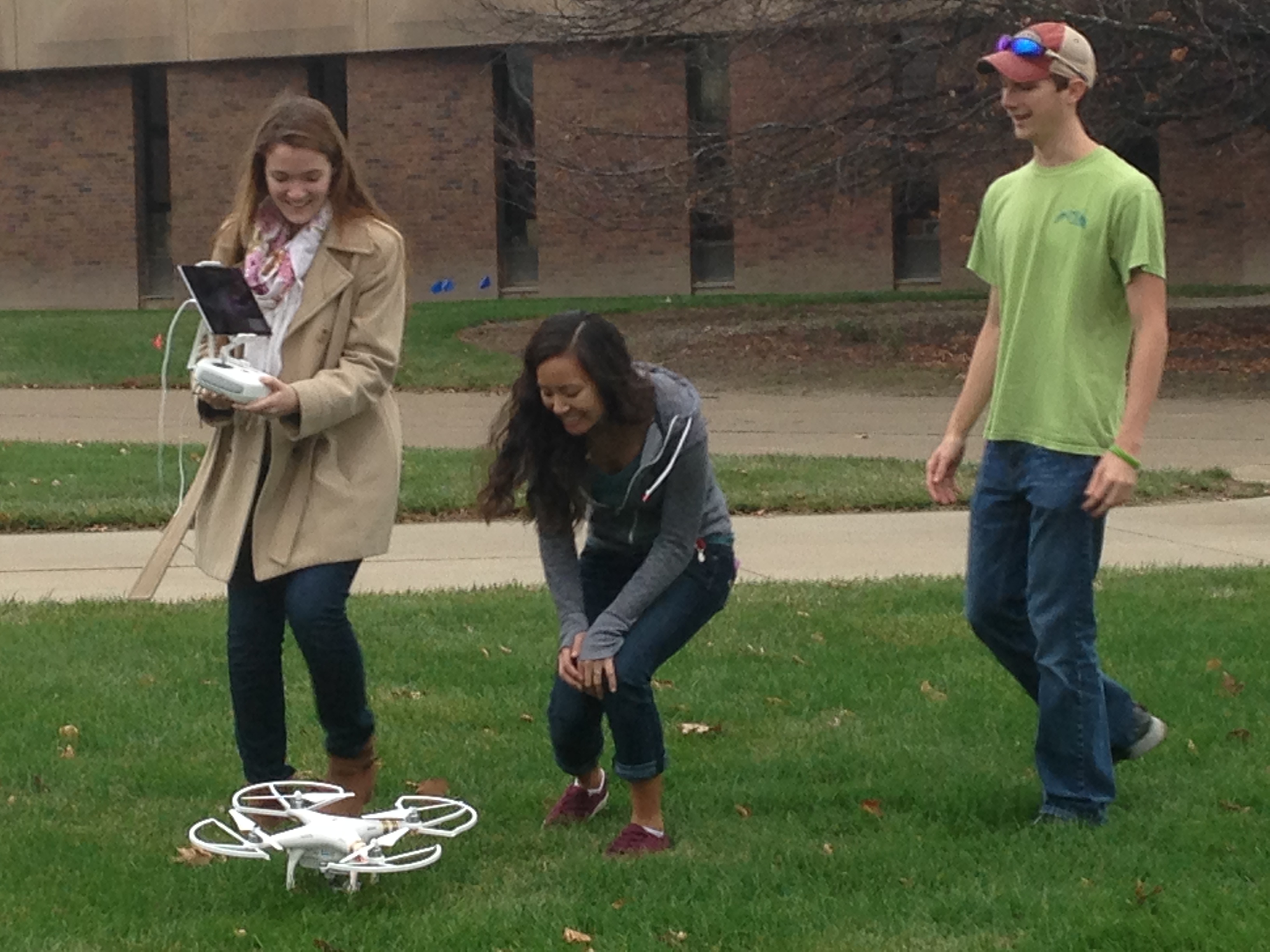 Students using drone out in the field