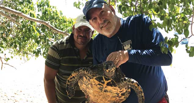 Frank Paladino with man and turtle