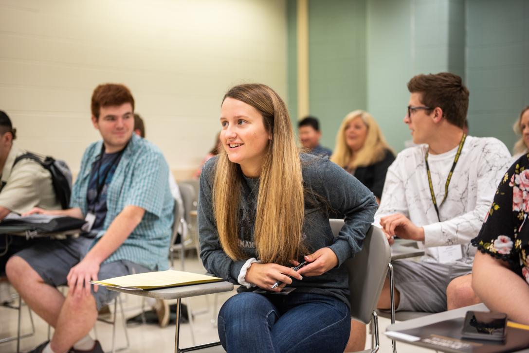 Students have a discussion in the classroom.