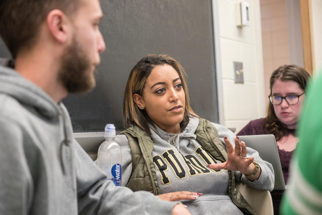 Students exchanging ideas in the classroom.