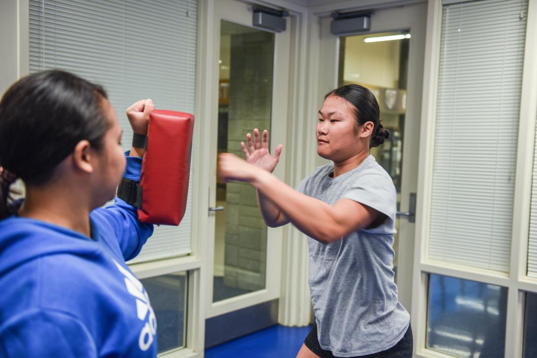 Student taking self-defense course.