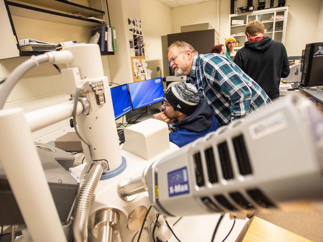 Student with microscope