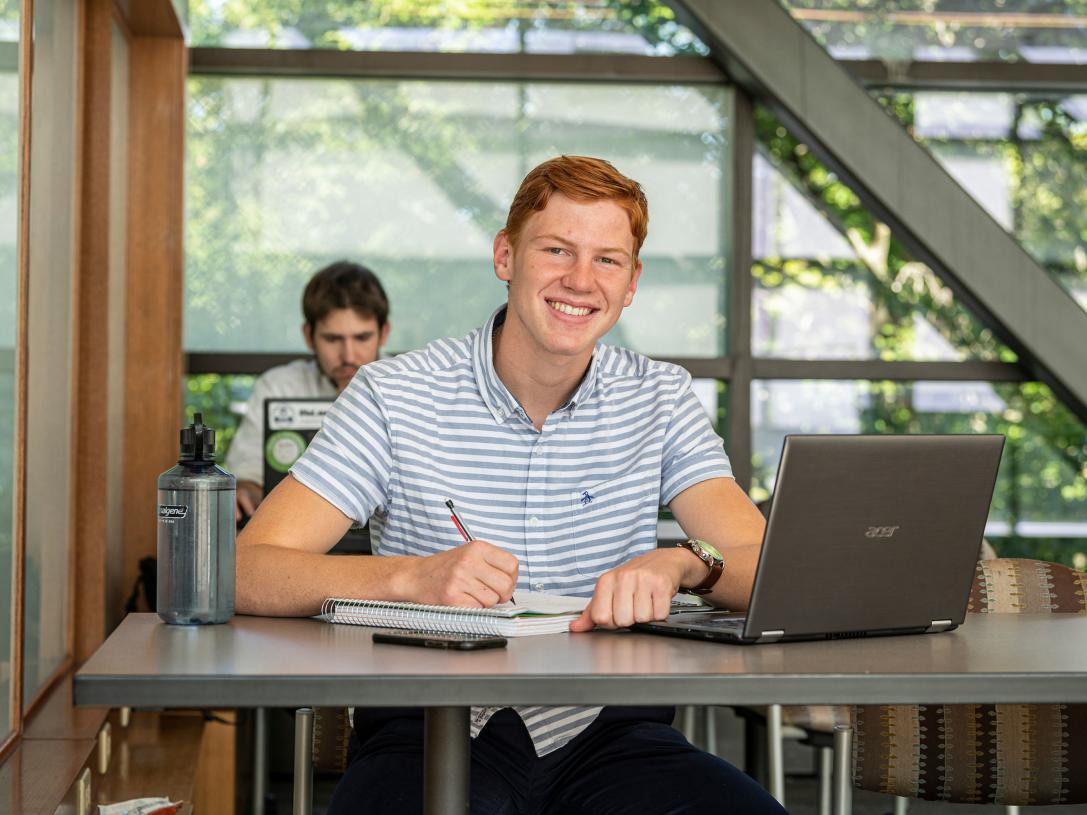 Male business student posing indoors.