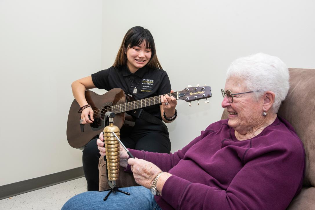 Music therapy sessions with an elderly client.