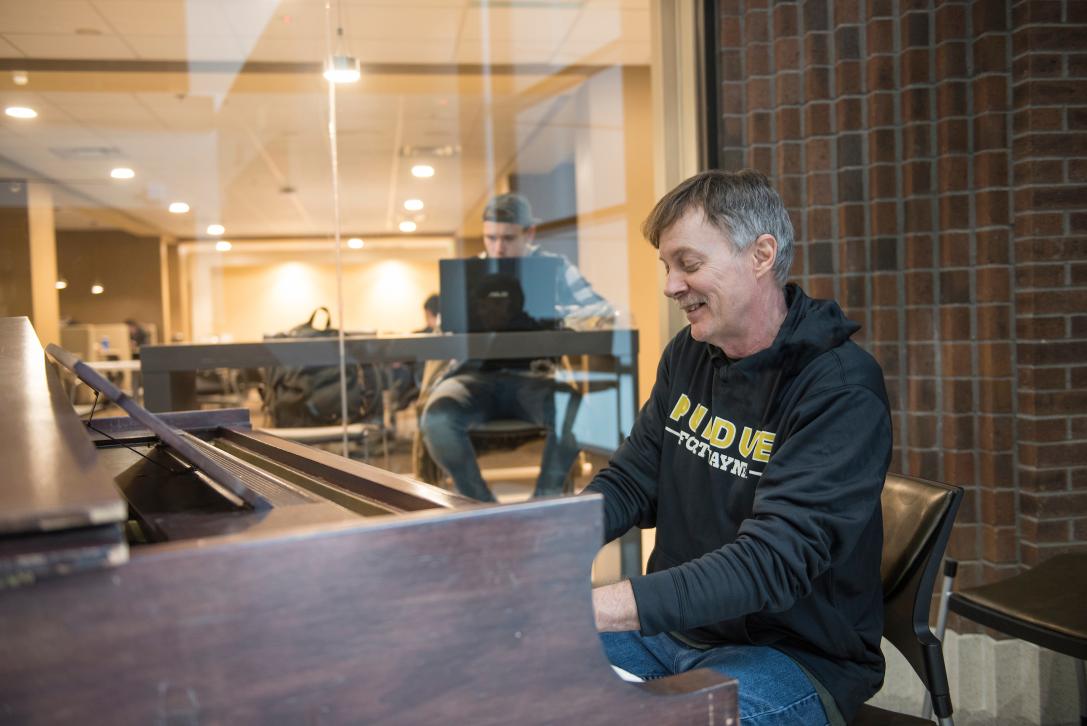 A student plays the piano.