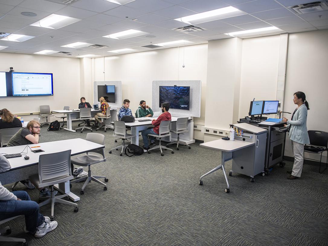 Professor Chao Chen teaching in a classroom