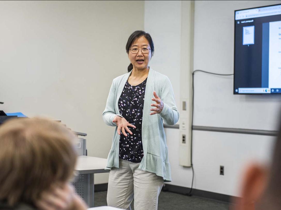 Professor Chao Chen teaching in a classroom