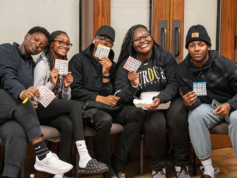 Smiling students at a bingo game