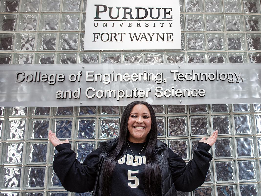 Ranesha Smith is standing in front of ETCS signage