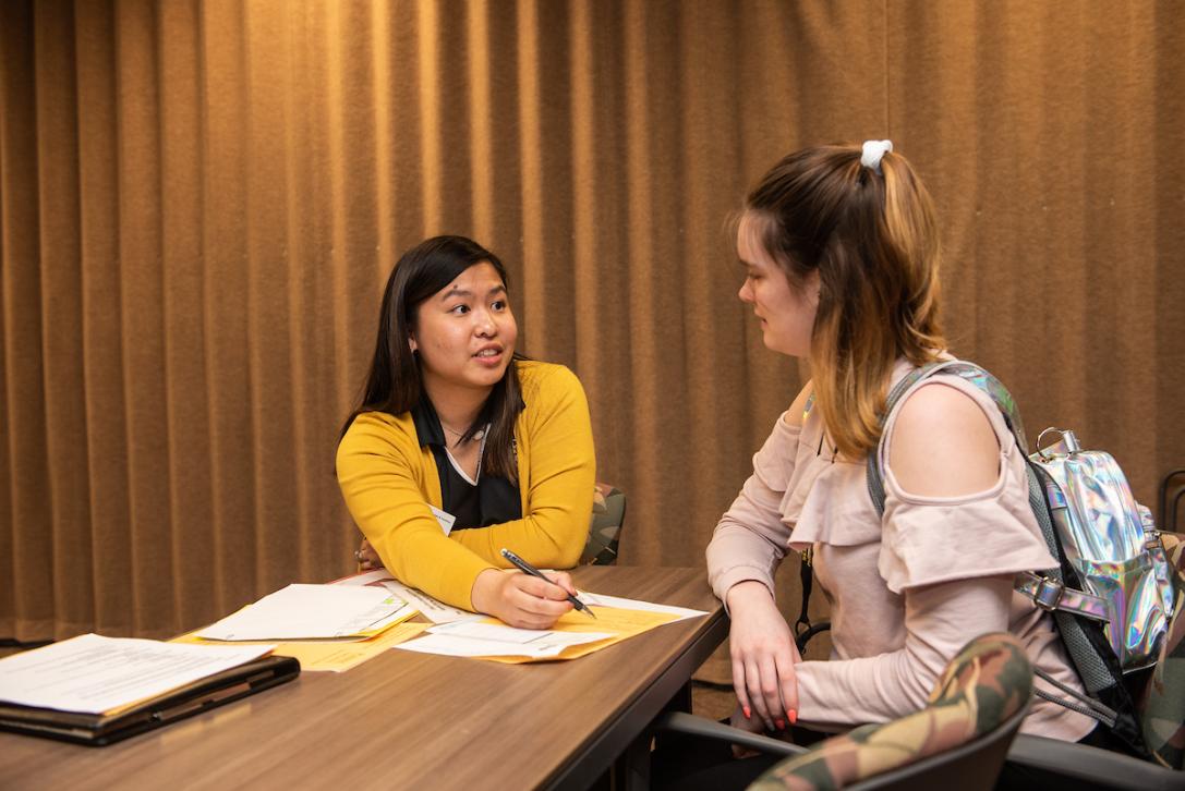 Student discusses class registration at New Student Orientation.