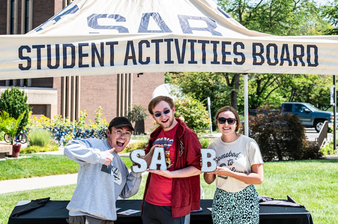 Students hold up letters for SAB.