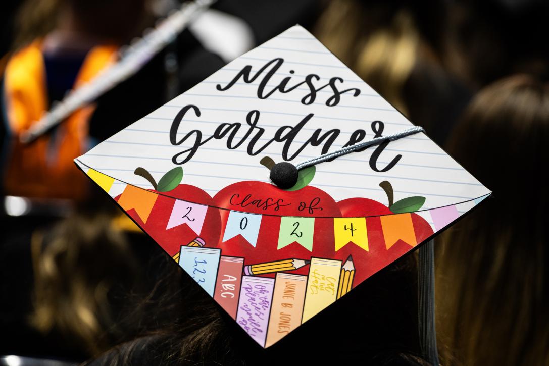 Decorated graduation cap for a new teacher.