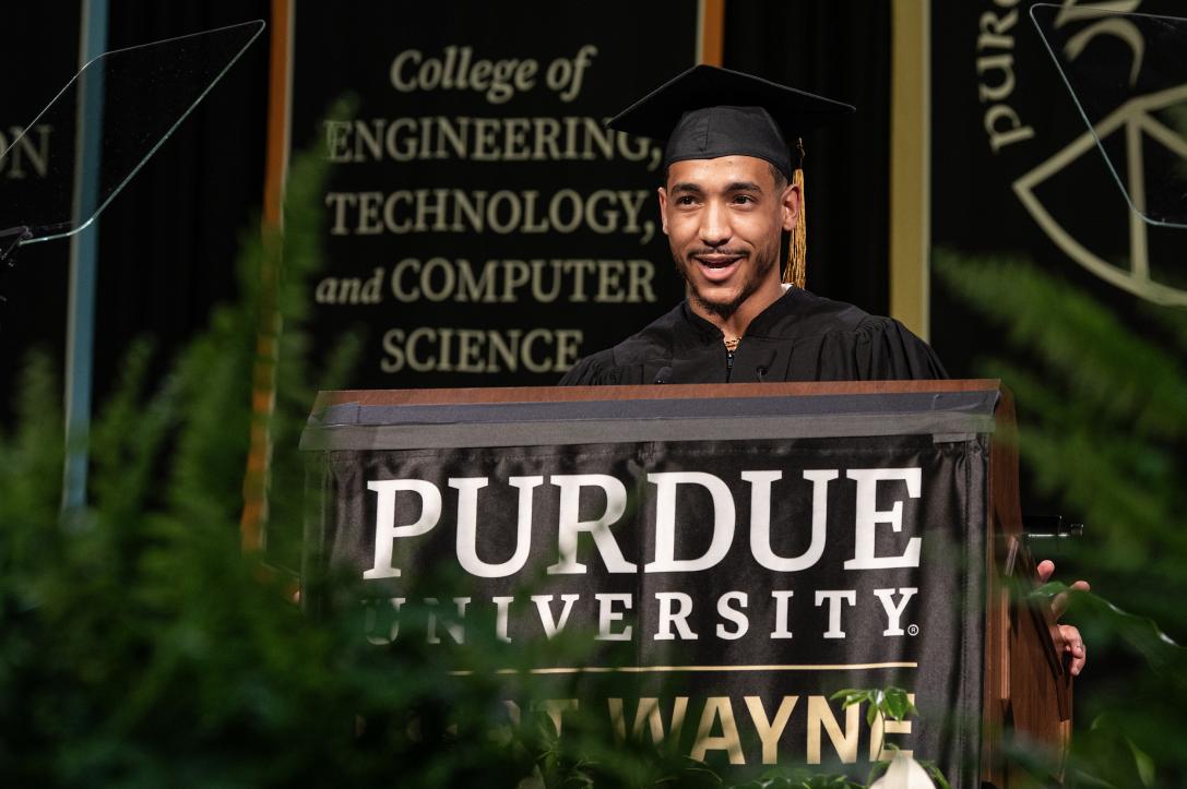 Student speaker at the podium for commencement.