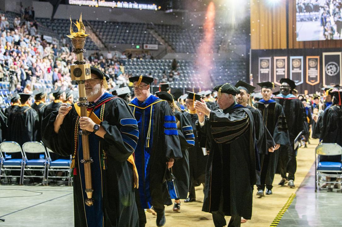 Marshals lead the exit from the arena.