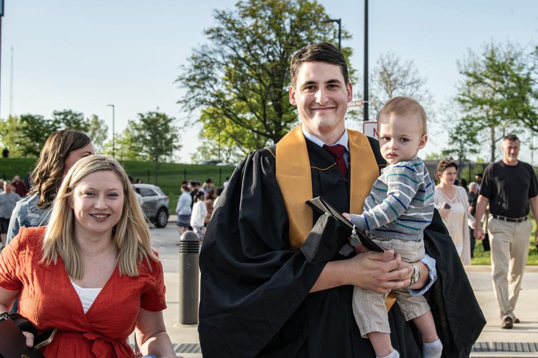 Graduating student with family.