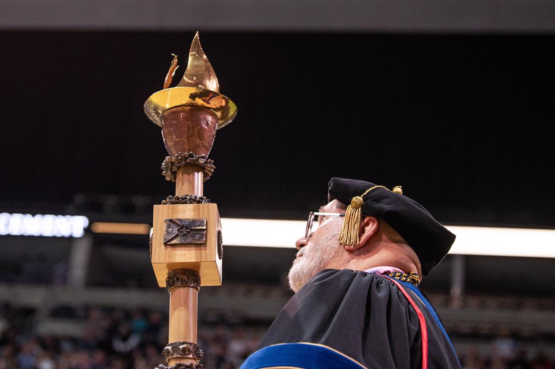 Commencement mace being carried in.