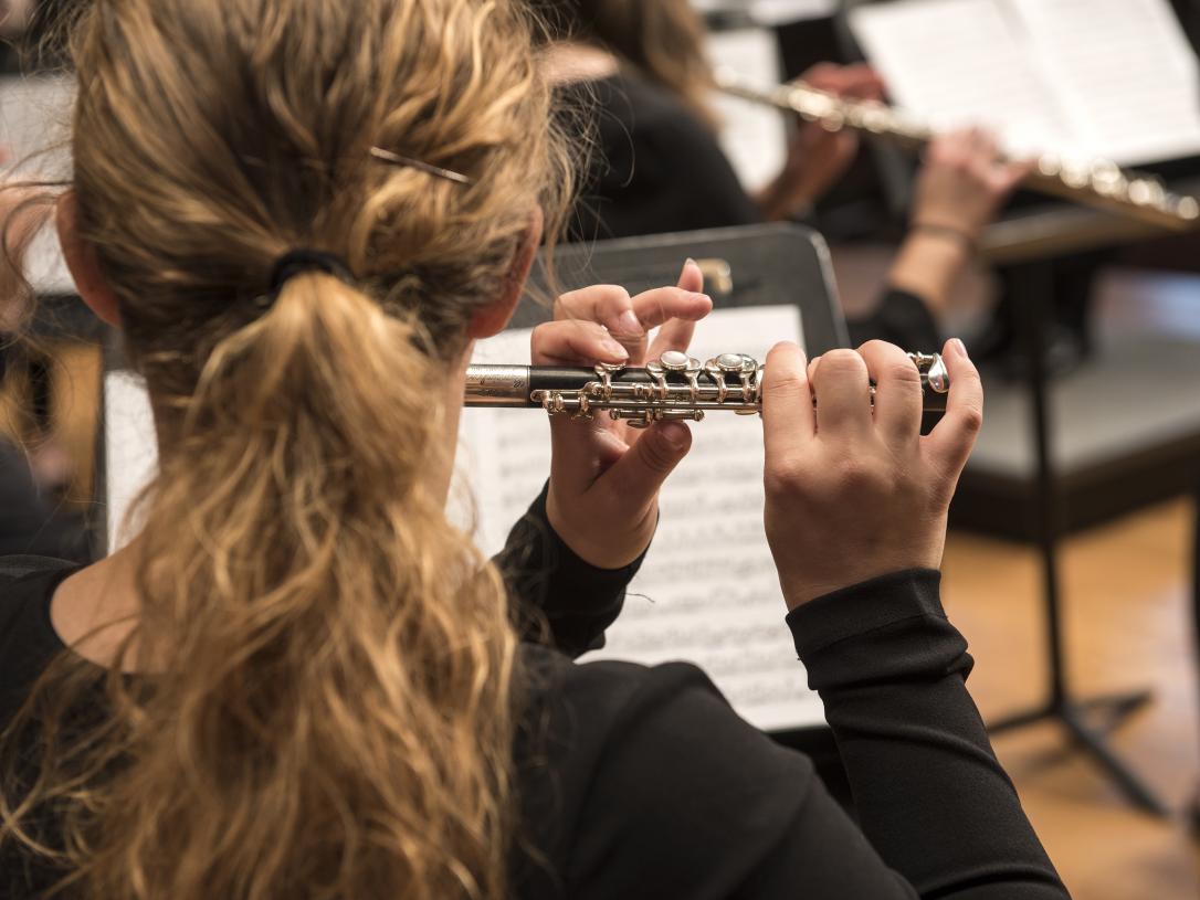 Student performing on stage.