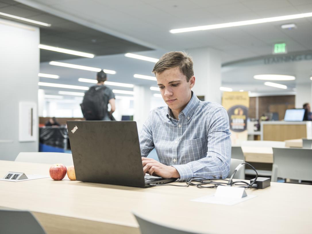 Student studying his class notes.