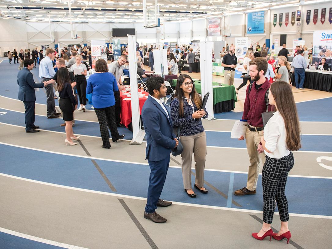 Students collecting information on careers at the career fair.