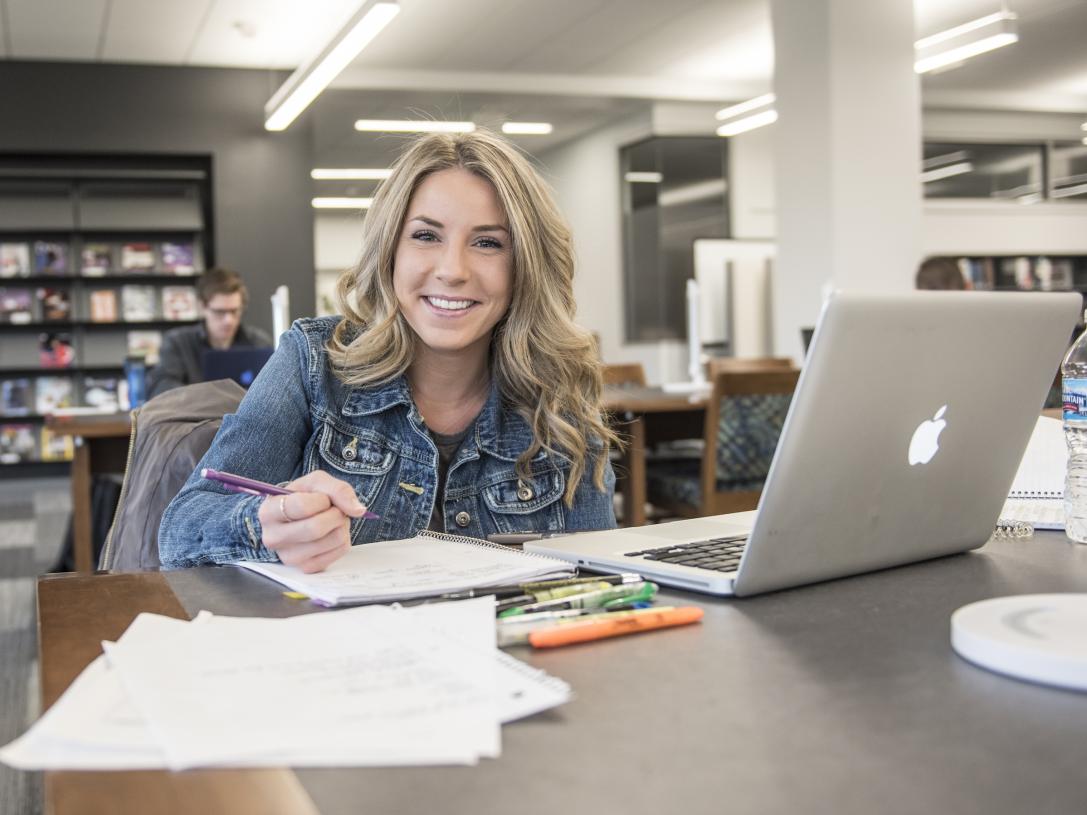 Student studying her class notes.