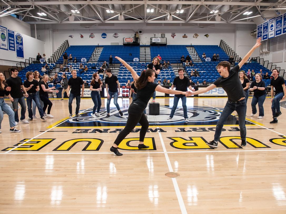 Students performing at homecoming.