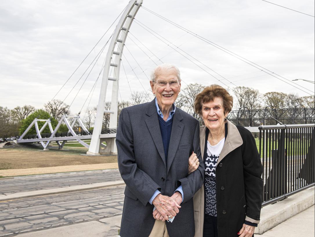 Mac and Pat Parker stand near the Parker-Cole-Crossing-Bridge