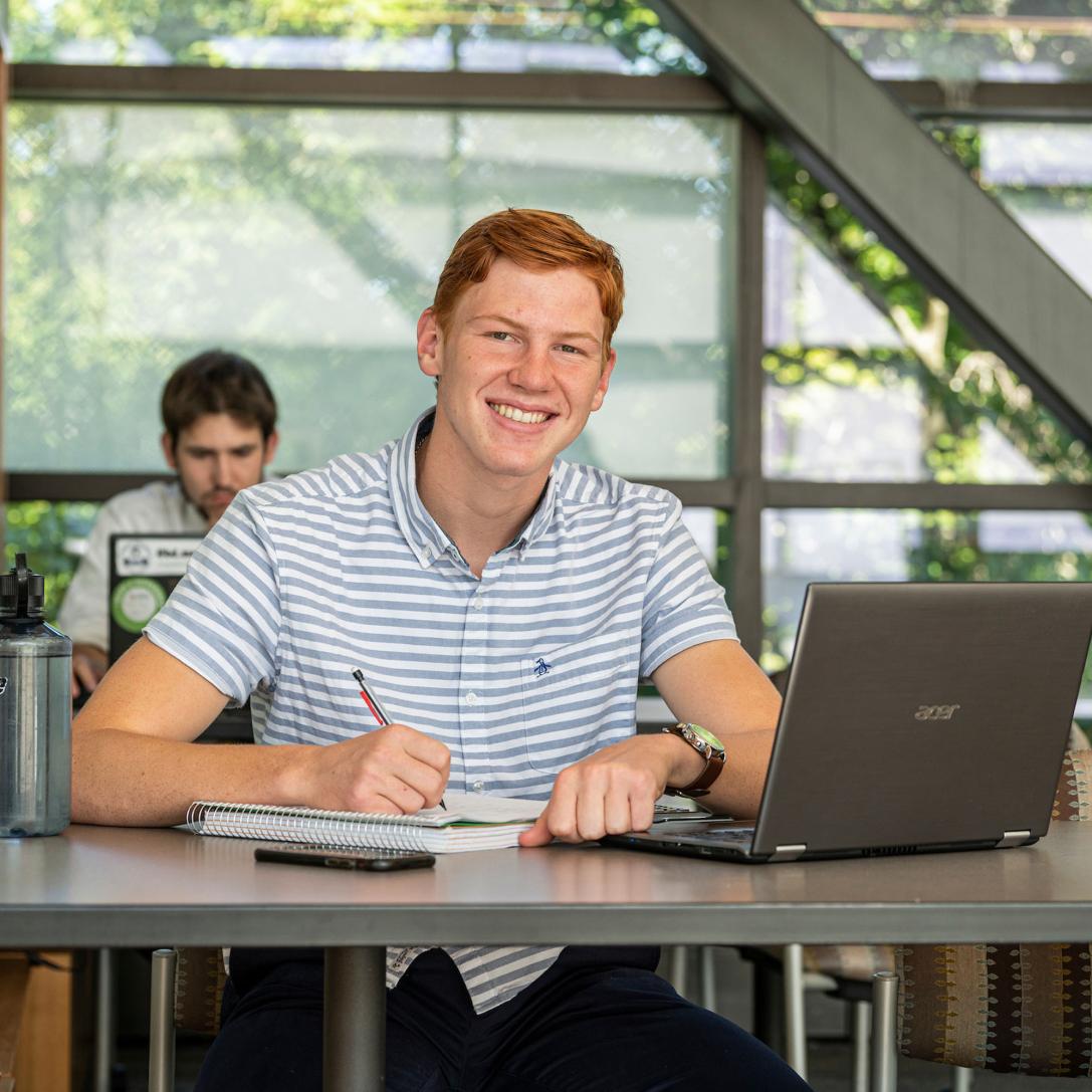 Male business student posing indoors.