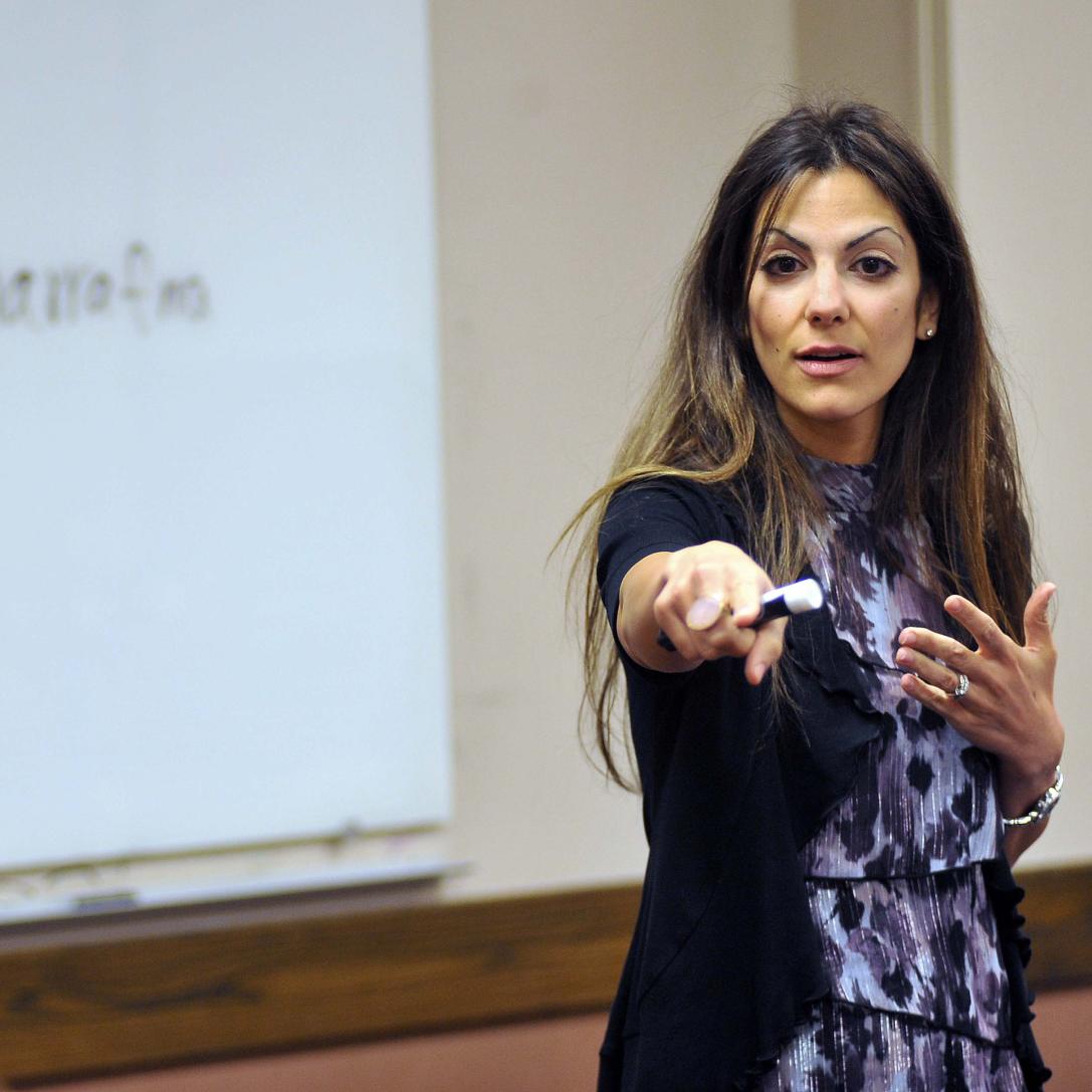 Professor teaching Arabic in a classroom setting.