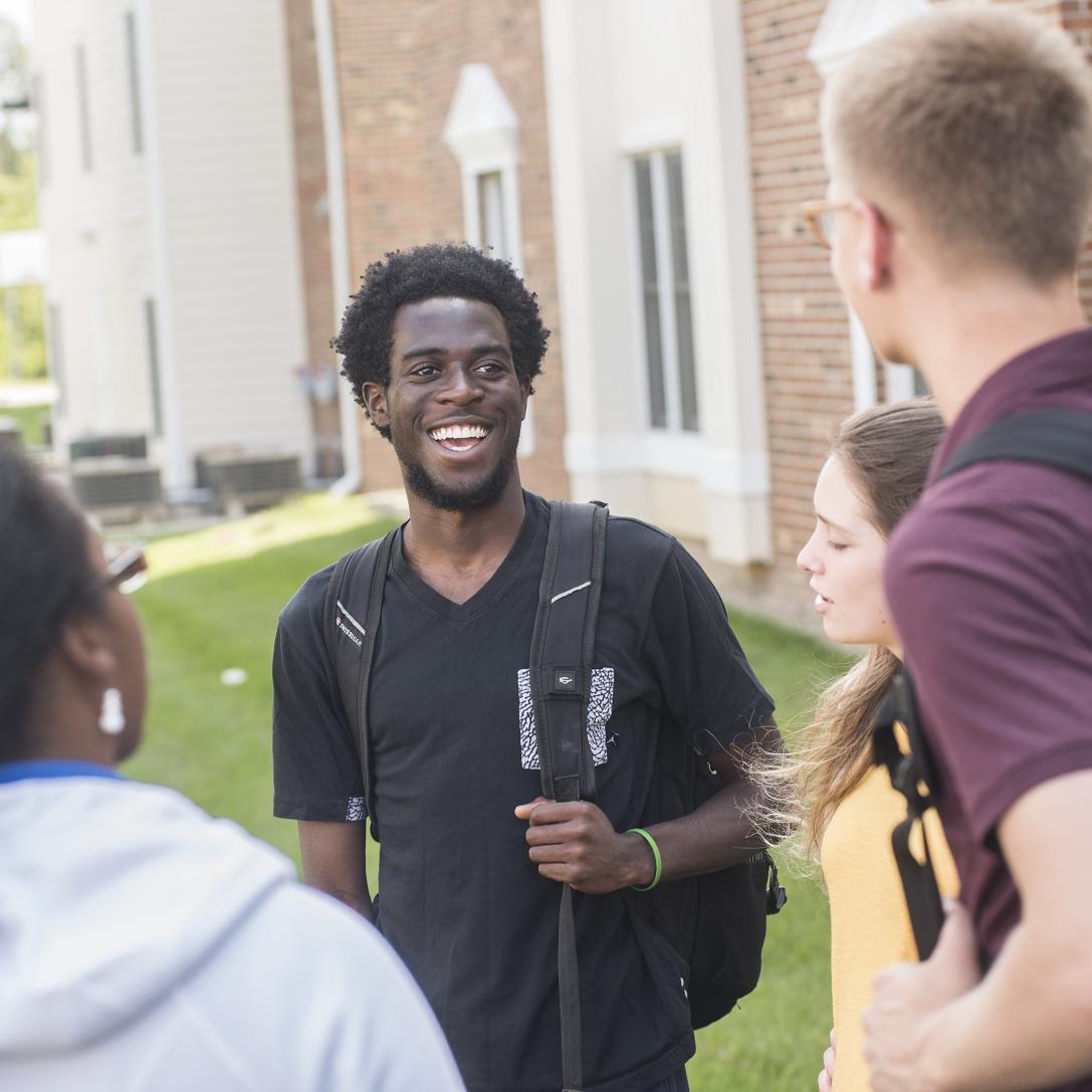 Students talking in a group.