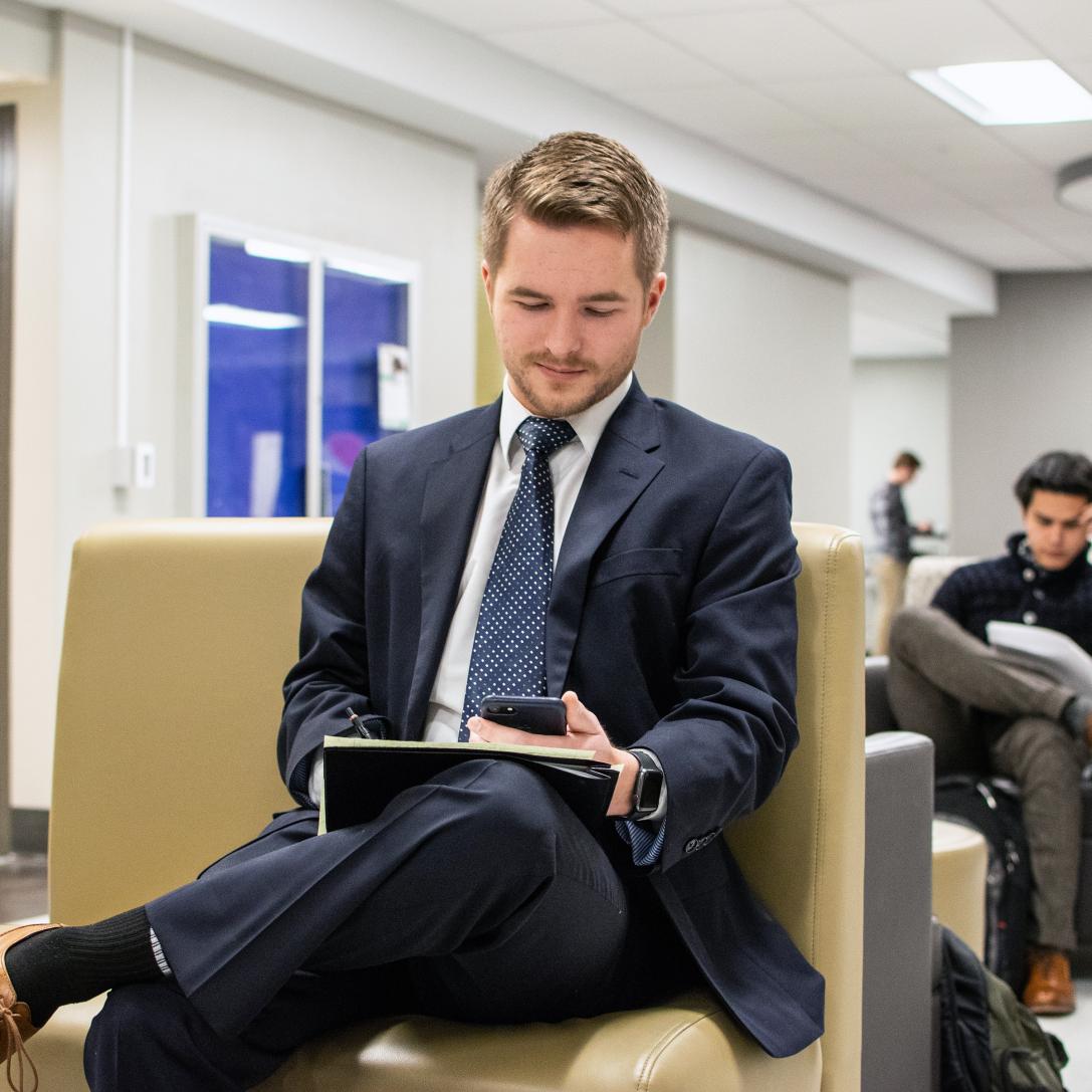 A male student on his cell