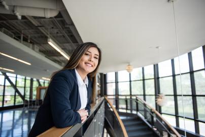 A female student smiling in the skybridge