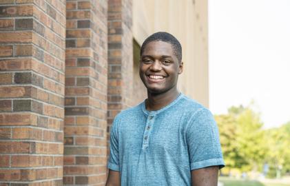 Male student posing outdoors.