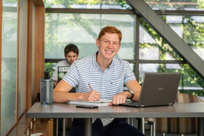 Male business student posing indoors.