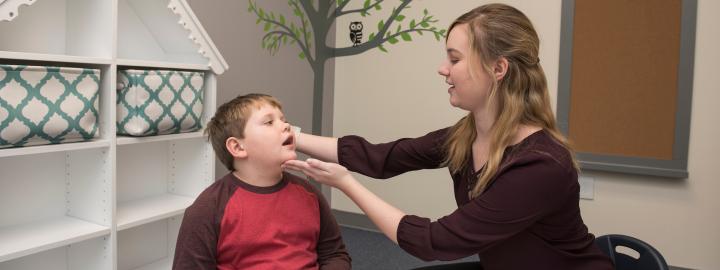 Student and child doing exercise