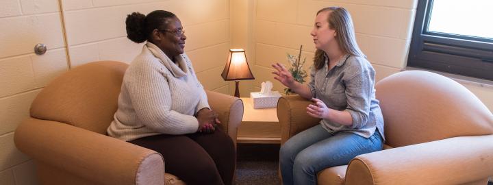 A PFW counseling student works with a client in the counseling center.