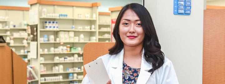 Pharmacist standing in a lab coat