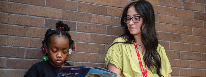 Student teacher works one-on-one with an elementary student.