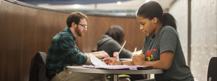 Student studying her class notes.