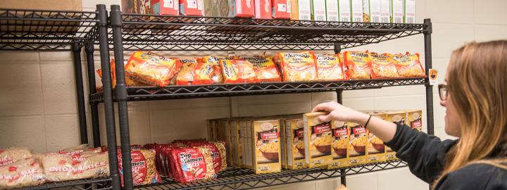 Student shopping at the food pantry facility.