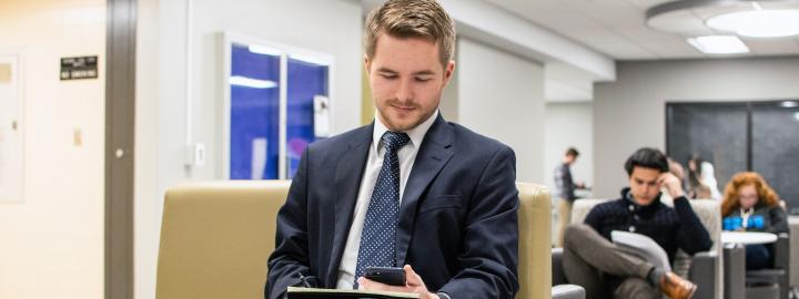 A male student on his cell