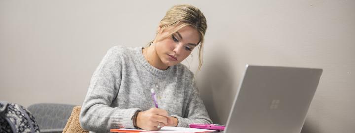 Student studying her class notes.