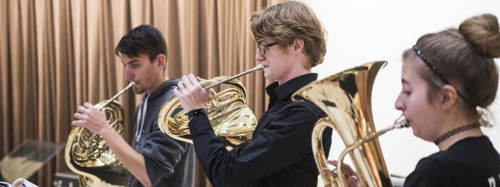 Students rehearsing together.