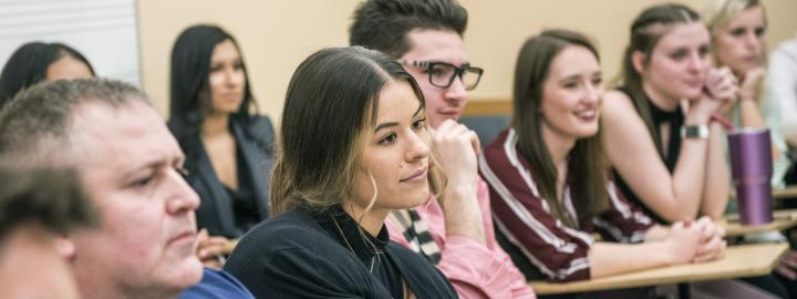 An MBA class listens to a a guest speaker