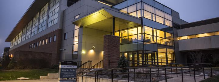 Athletics Center at dusk on campus.