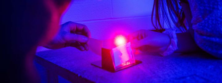 Physics Hologram Lab with students observing the demonstration.