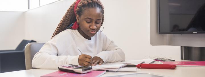 Student studying her class notes.