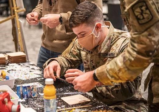 ROTC student Rylan Brown and friends work on some craft projects at the SErving Those Who Serve event.