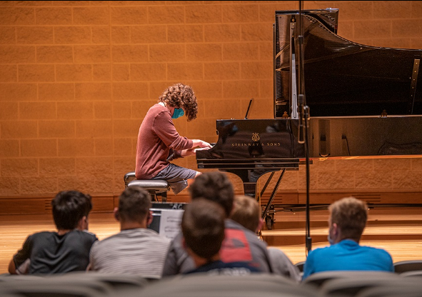 Student playing piano