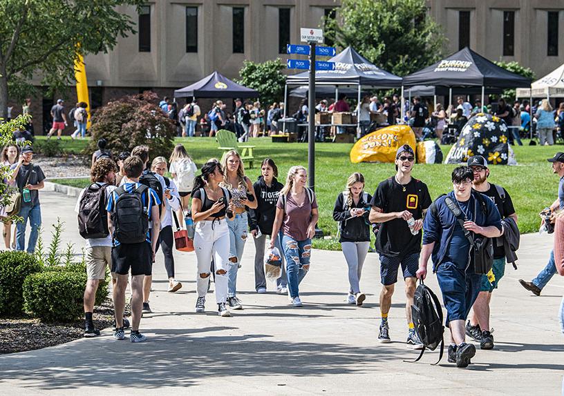 Students are walking near the science mall